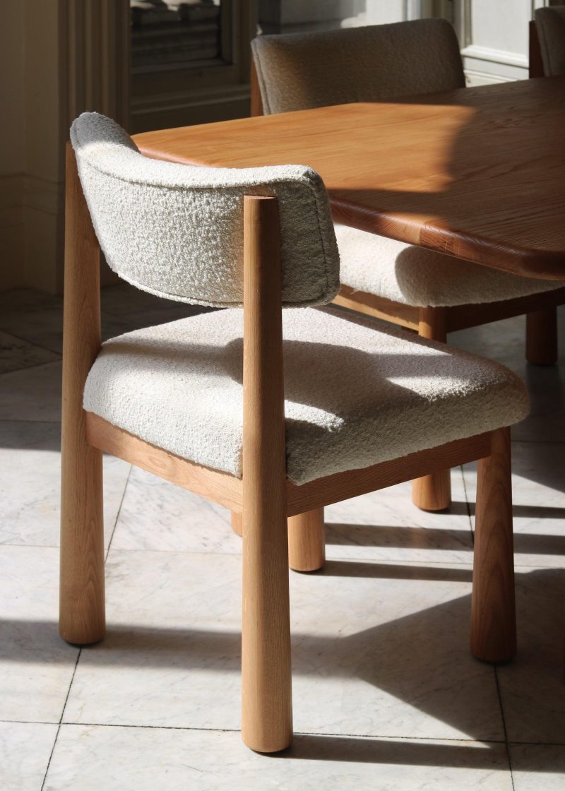 wood upholstered white boucle dining chairs